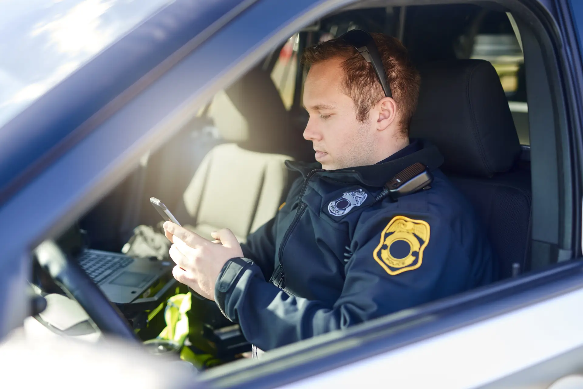 Policeman in cruiser