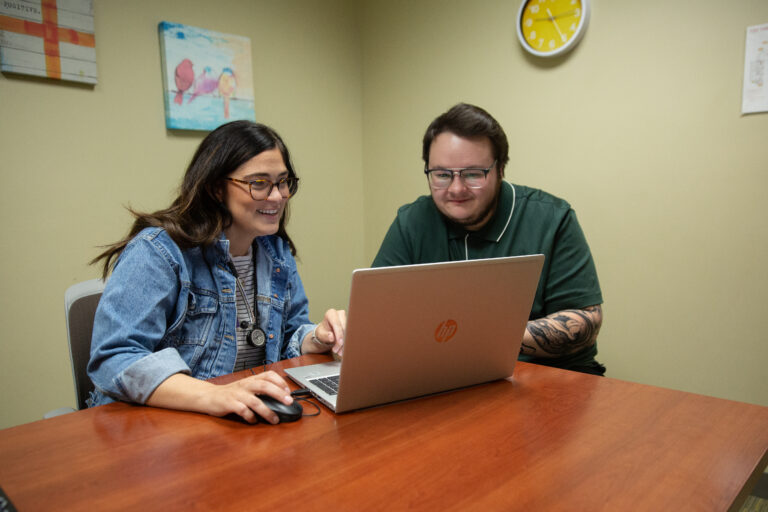 Guardify customers reviewing files on a computer